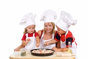 397252-kids-and-their-mother-preparing-a-pizza